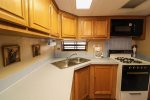 Fully furnished kitchen with plenty of prep and cooking space